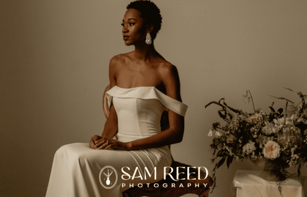 LGBTQ+ Vendors Category Vendor Sam Reed Photo Editiorial photograph of a beautiful bride beside a table of flowers